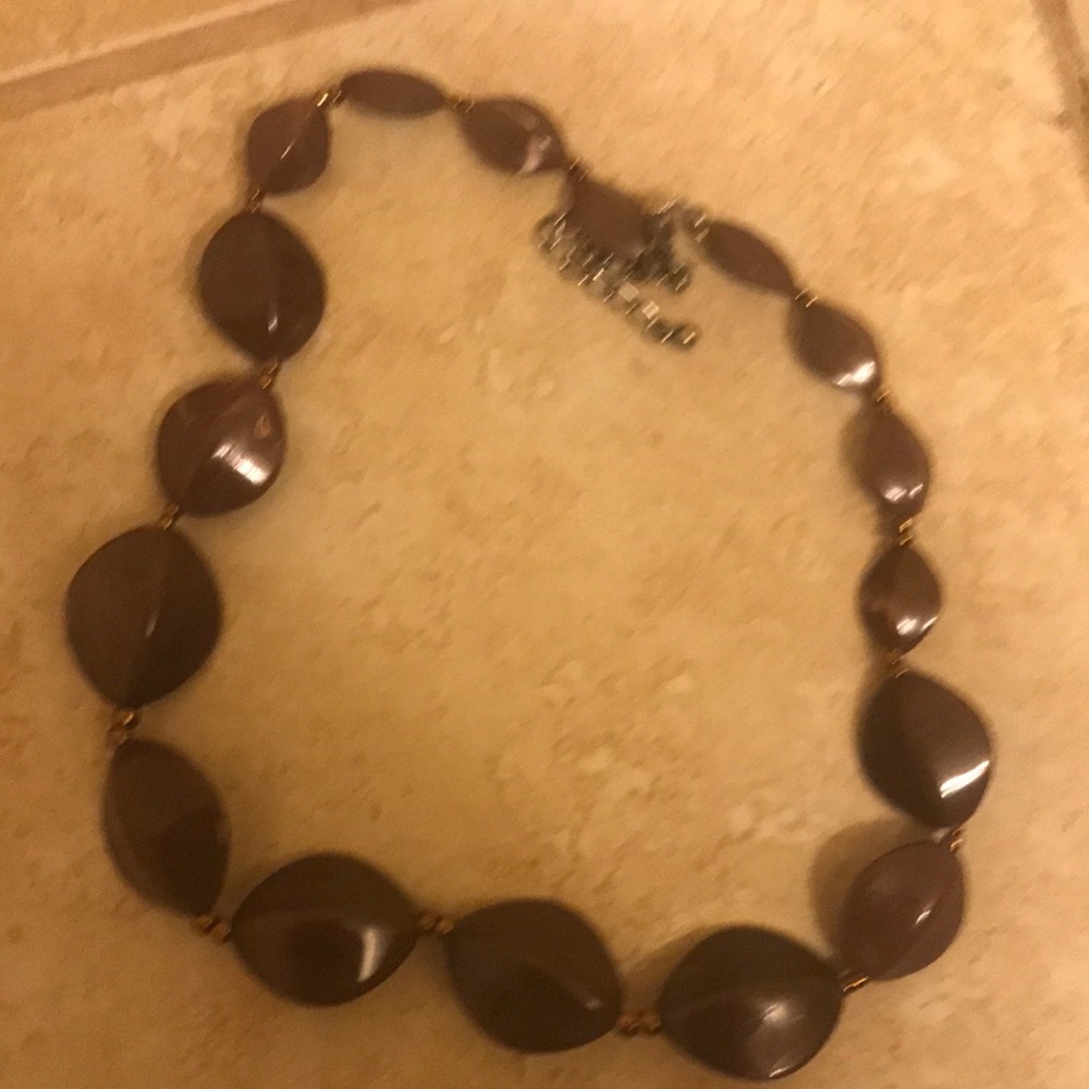 Body Shop necklace with medium brown beads.